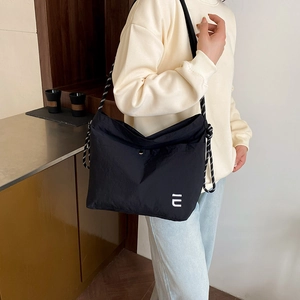Waterproof nylon crossbody bag in black with IU logo and stylish thick braided strap