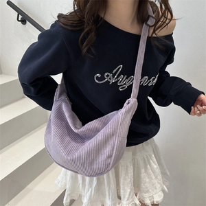 Fashionable light purple corduroy crescent crossbody tote bag for women shown on model