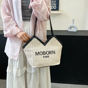 Sac cabas en paille tissée crème chic avec bordure en cuir noir et logo MOBORN PARIS