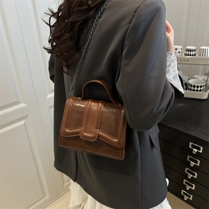 Brown crocodile embossed leather chain bag with top handle for women in minimalist style