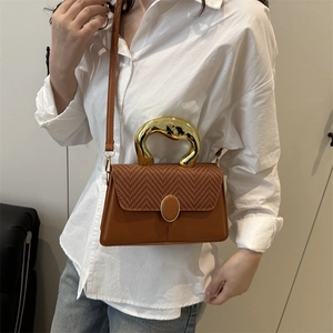 Brown handbag with geometric gold handle and woven texture crossbody strap for women