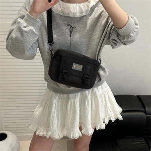 Japanese style black nylon messenger bag for women with adjustable buckle straps