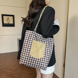 Brown and white plaid canvas tote bag with yellow pocket and elegant embroidery