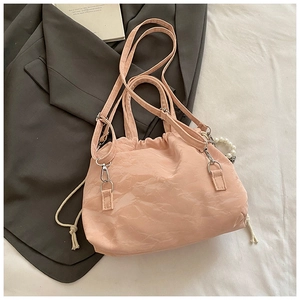 Detail view of pink butterfly backpack with pearl chain and soft wrinkled texture