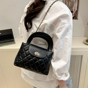 Classic black quilted leather crossbody bag with chain strap for women in office setting