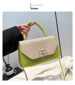 Close-up of green leather handbag with beige woven texture and golden BB buckle
