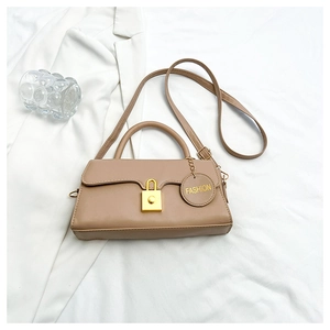 Detail of khaki leather handbag with gold square buckle and FASHION charm