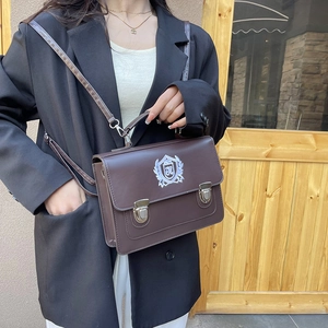 Vintage brown JK uniform satchel with academy style shield embroidery and silver clasp