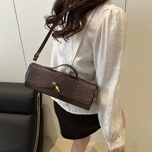 Classic dark brown crocodile embossed shoulder bag with gold metal latch and top handle