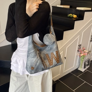 Gray canvas hobo tote bag with brown leather W patch and matching round coin pouch