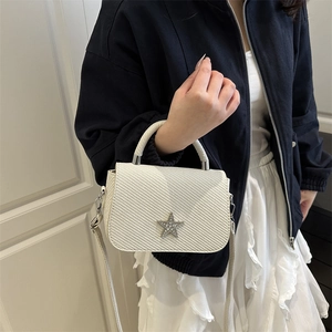 Beige quilted crossbody bag with sparkling star buckle and chain strap for women