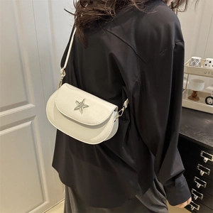 White minimalist crossbody bag with rhinestone star detail shown on model back view