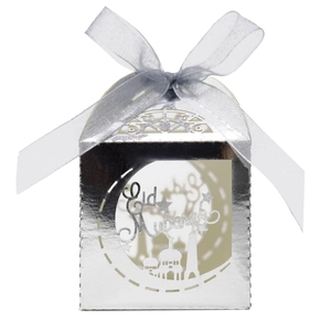 Detail of silver laser-cut Eid Mubarak candy box with mosque silhouette and ribbon