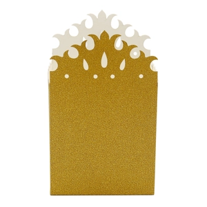 Detailed close-up of glitter gold party favors box with hollow crown cutout patterns