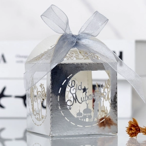 Detailed laser cut silver Eid Mubarak gift box with crescent moon and ribbon tie decoration