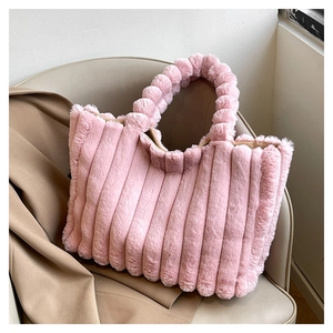 Detail showing the vertical plush texture and soft pink faux fur of this large tote bag
