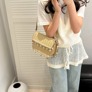 Bohemian straw woven crossbody bag with tassel shells and adjustable strap for women
