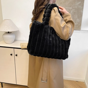 Chic black plush tote bag with unique bubble ball handles and vertical stripes for women