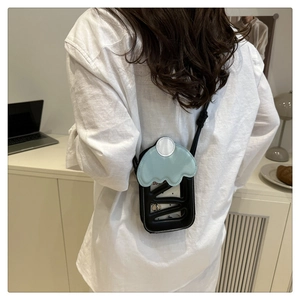 Chic cherry cake phone bag with hollowed-out black leather and wavy blue trim details