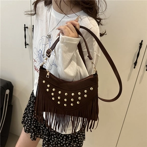Bohemian dark brown suede crossbody bag with fringe tassels and gold rivets detail
