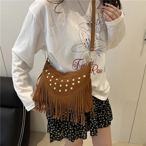 Bohemian brown suede crossbody bag with vintage tassels and gold studs detail