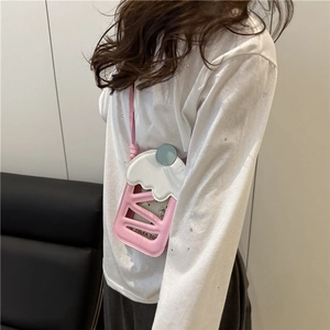 Pink and white dessert-shaped mini crossbody phone bag with a stylish long strap