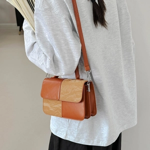 Contrast color patchwork shoulder bag with checkered texture and adjustable strap