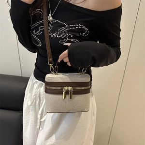 Chic two-tone box handbag with beige woven texture and brown leather trim for women