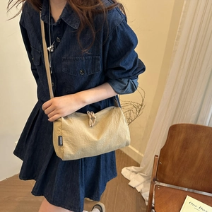Minimalist beige nylon crossbody bag with drawstring detail for daily casual wear