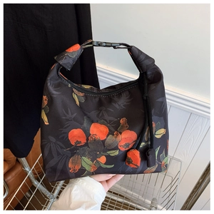Detail of New Chinese style black crescent bag with persimmon pattern and buckle handle