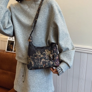 Oriental crescent moon bag with floral print and adjustable wide shoulder strap