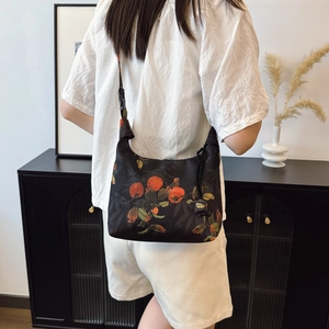 Chinese style crescent bag with Xiangyun silk and orange persimmon prints on black fabric
