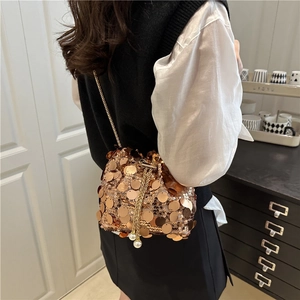 Chic rose gold sequin bucket bag with drawstring and gold chain strap for women