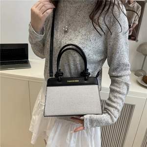 Fashionable black and white contrast handbag with large capacity and detachable strap