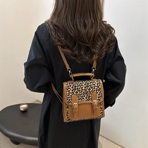 Large capacity leopard print backpack with faux leather details and gold metal buckles