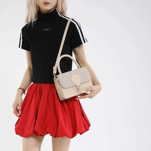 Beige patchwork crossbody bag with textured flap and elegant gold buckle hardware