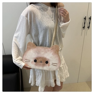Detailed close-up of cream and brown cat face tote bag with soft PU leather material