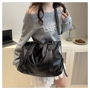 Detailed close-up of high-quality PU leather texture and reinforced stitching on tote bag