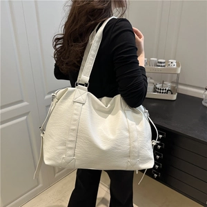 Large white minimalist tote bag in pebbled faux leather for travel and daily commute