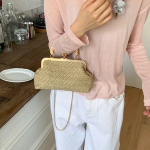 Elegant woven metallic gold clutch handbag with round clasp and chain strap for women