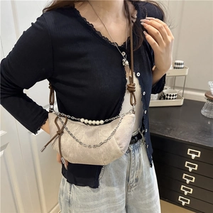 Chic light gray suede crescent crossbody bag with pearl chain and knot strap detail