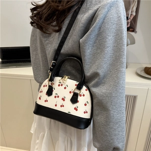 Fashionable cherry print shell bag with black leather straps and large capacity for daily use
