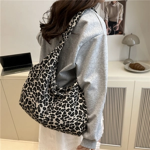 Large capacity leopard print canvas tote bag with wide strap for versatile shoulder use