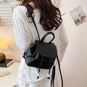 Minimalist black PU backpack with drawstring closure and colorful bead accents for travel