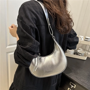 Fashionable silver crescent underarm bag with metal chain strap and leather texture