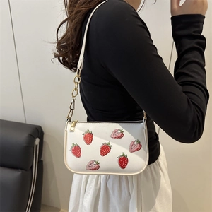 Fashionable half moon underarm bag featuring strawberry print and gold chain strap