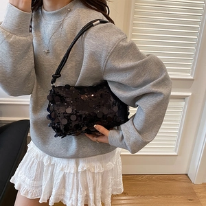 Chic black sequined shoulder bag for women with glossy finish and sleek zipper closure