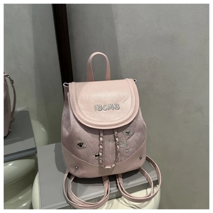 Detailed embroidery IBCMB lettering and metal chain on pink patchwork backpack