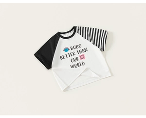 Close-up of kids' cotton T-shirt with letter print and asymmetrical raglan sleeves