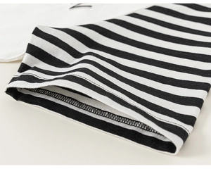 Close-up of black and white striped sleeve cuff with double-needle stitching on cotton T-shirt
